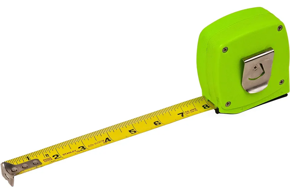 A green retractable tape measure with its yellow tape pulled out
